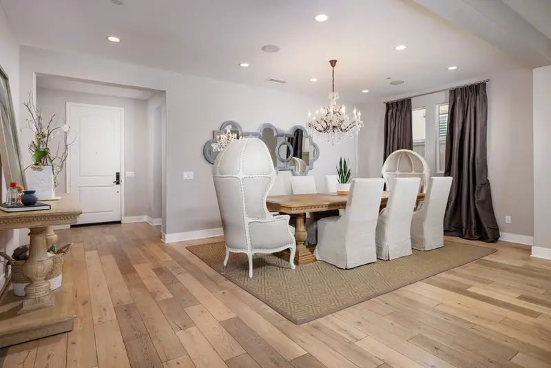 Dining room with quatrefoil mirror cluster and crystal chandelier — Aliso Viejo real estate photography
