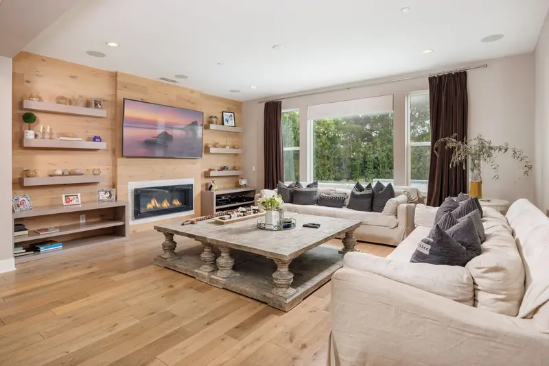 Family room with built-in shelving and wood accent wall — Aliso Viejo real estate photography