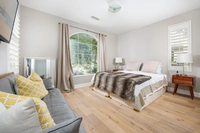Guest bedroom with arched window — Aliso Viejo real estate photography