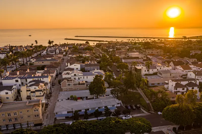 Aerial sunset view looking north over the harbor toward Catalina Island, Corona del Mar