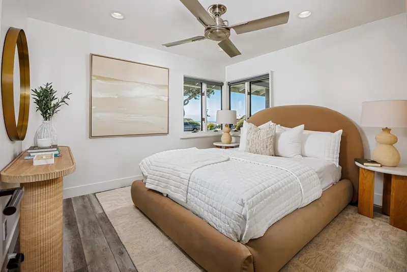 Bedroom with upholstered arched headboard — Corona del Mar real estate photography