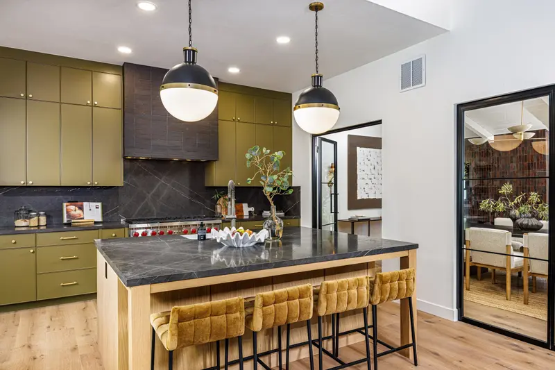 Modern kitchen with island seating and a view into the dining room, Harbor View, Corona del Mar