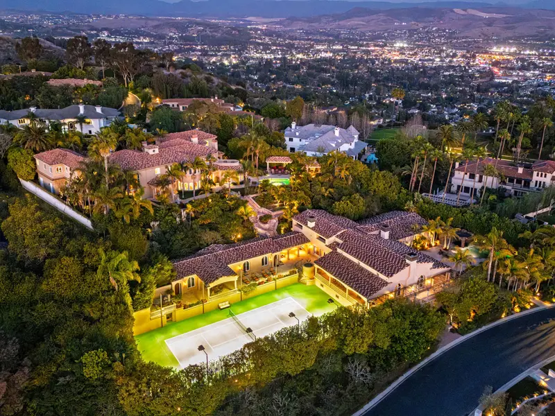 Aerial view of the lit tennis court at night — Laguna Niguel real estate photography
