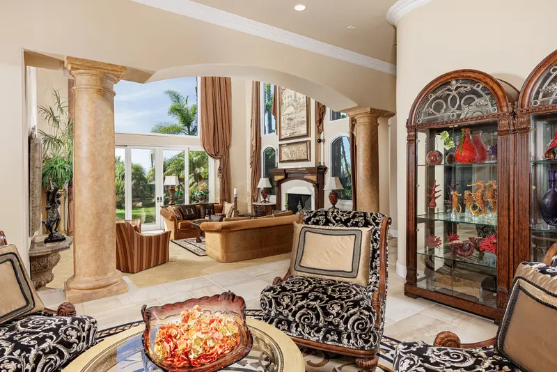 Sitting room with curio cabinet and columns — Laguna Niguel real estate photography