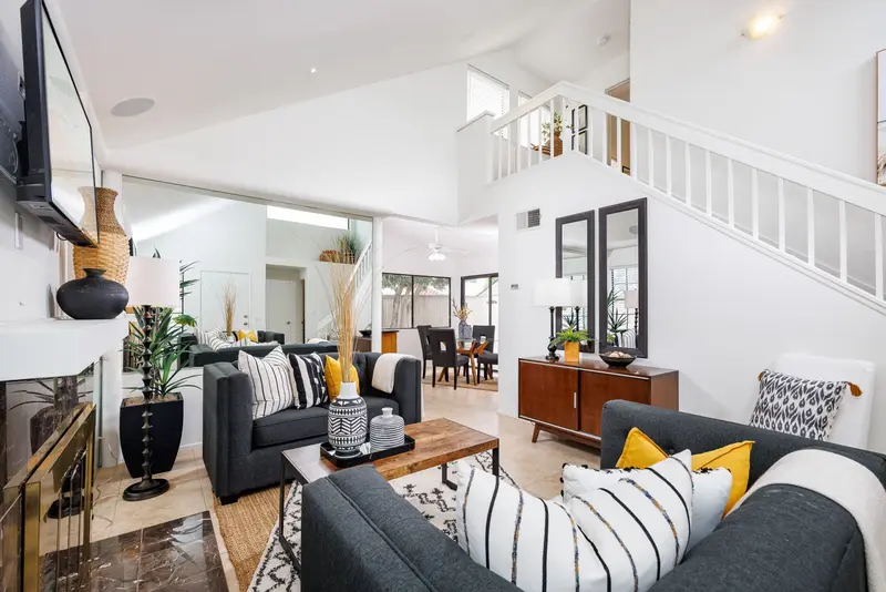 Living room with staircase and open loft above — Lake Forest real estate photography