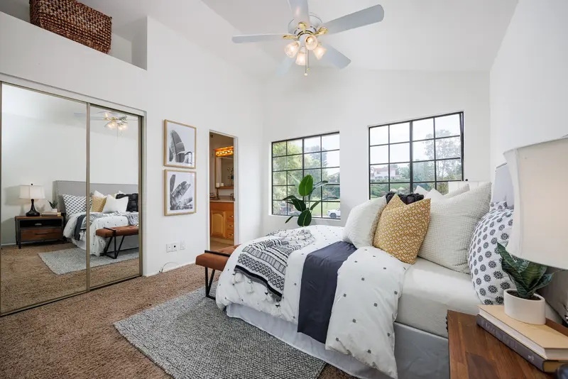 Secondary bedroom with mirrored closet doors — Lake Forest real estate photography