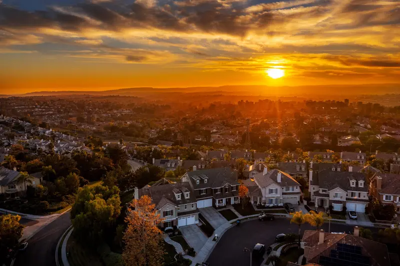 Aerial drone view of a home's front exterior at sunset, Mission Viejo