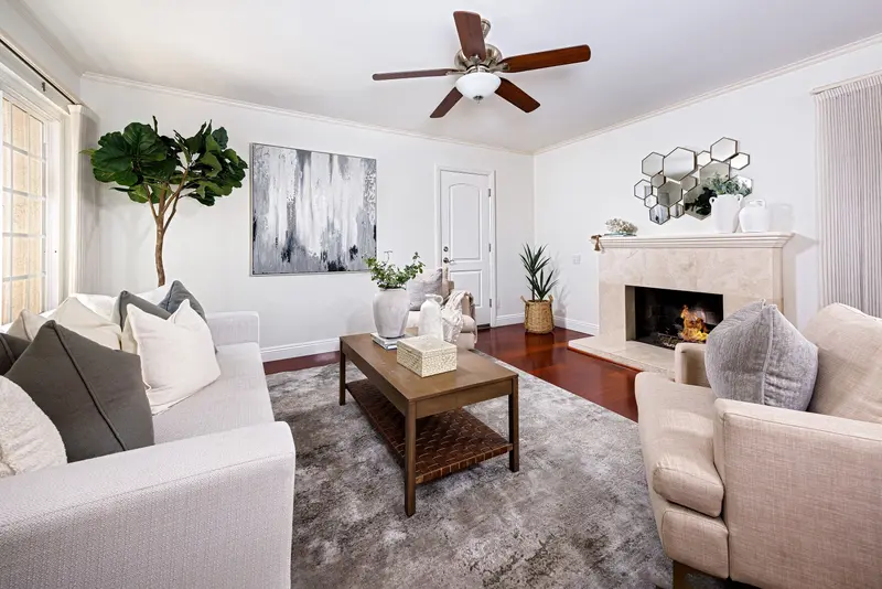 Living room with stone fireplace and staged seating — Mission Viejo real estate photography