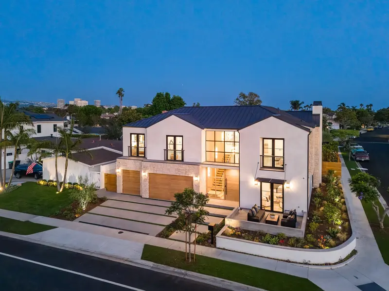 Aerial twilight view of a luxury front exterior, Dover Shores, Newport Beach