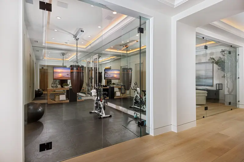 Home gym behind glass walls — Newport Beach real estate photography