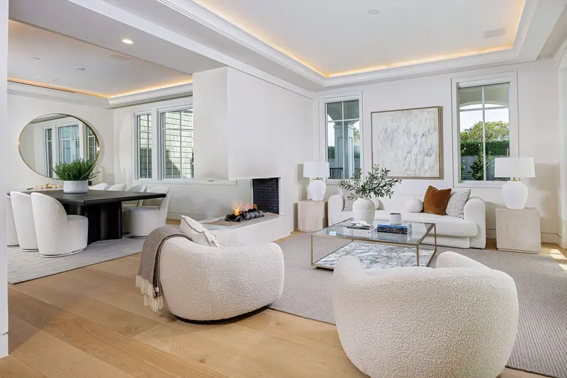 Living room with fireplace and dining beyond — Newport Beach real estate photography