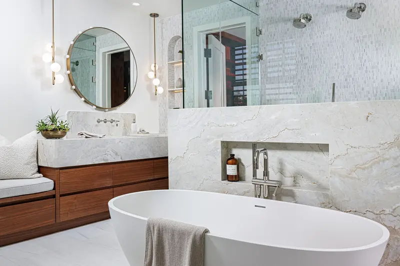 Primary bathroom tub and dual vanities — Newport Beach real estate photography