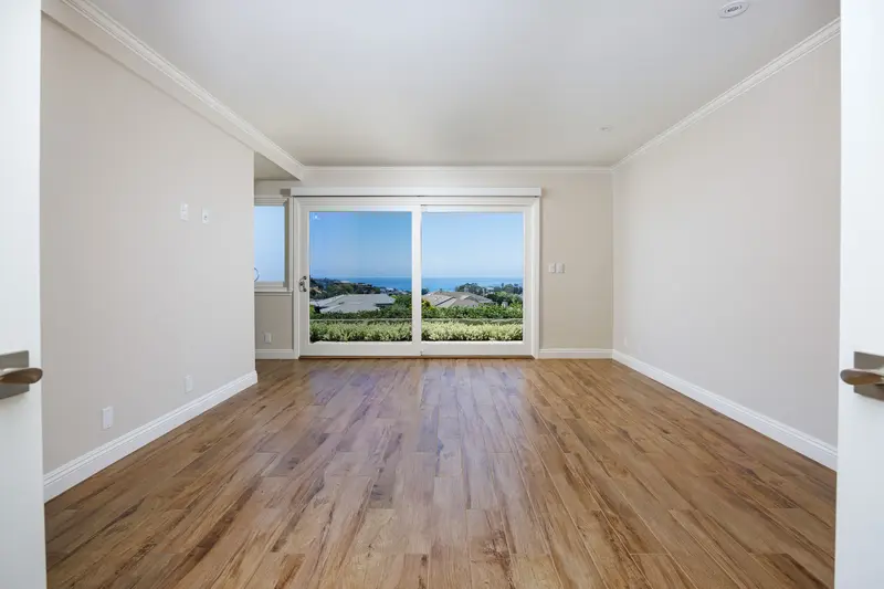 Primary bedroom virtually staged with coastal decor, after, Newport Beach — before