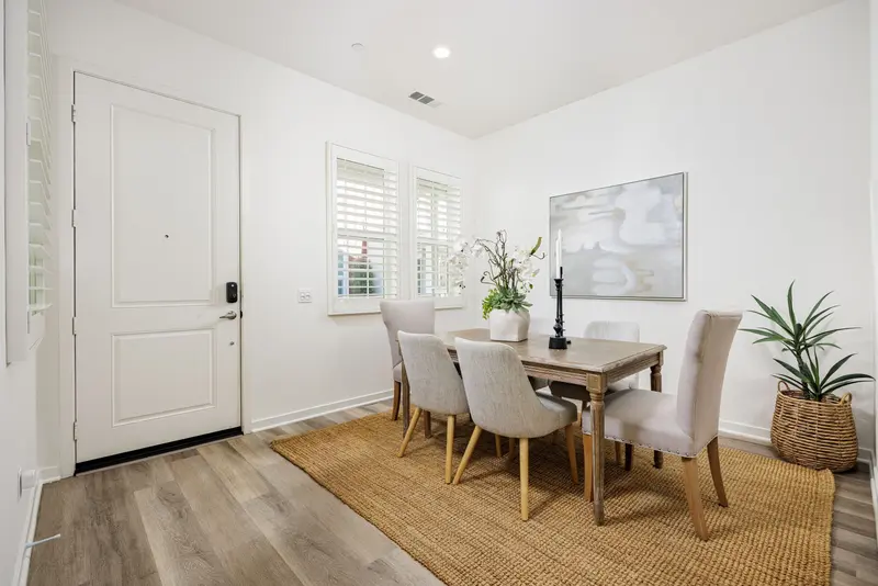 Dining room with jute rug and orchid centerpiece — Rancho Mission Viejo real estate photography