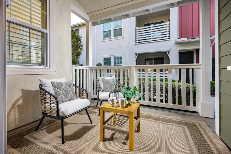 Front porch seating with string lights and neighboring homes — Rancho Mission Viejo real estate photography