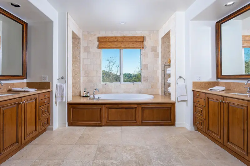 Primary bathroom with soaking tub and hillside view — San Clemente real estate photography