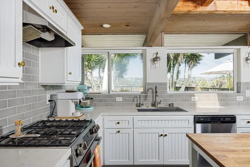 Kitchen with subway tile and hillside window view — San Clemente real estate photography