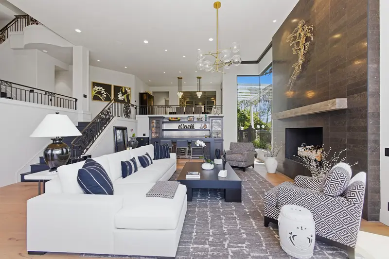 Great room with ornate iron staircase — San Juan Capistrano real estate photography