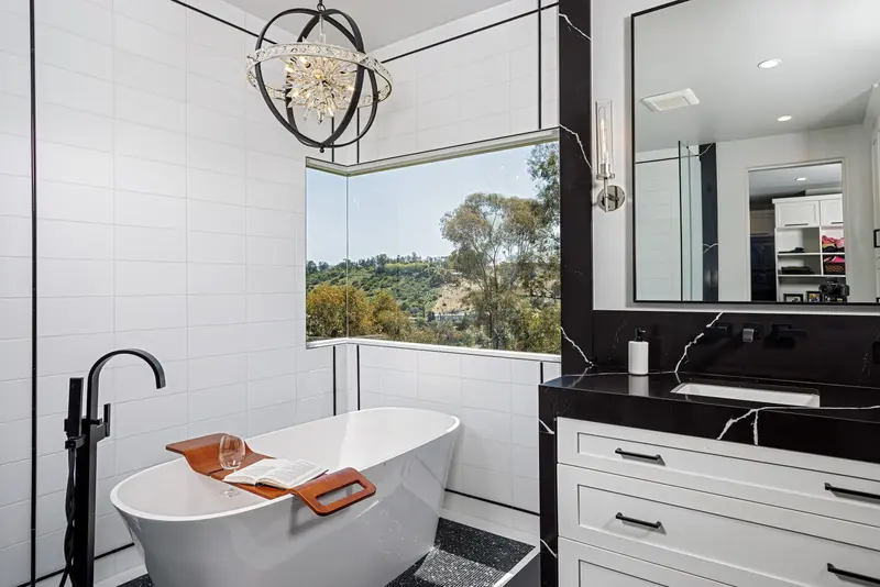 Primary bathroom soaking tub with hillside view — San Juan Capistrano real estate photography