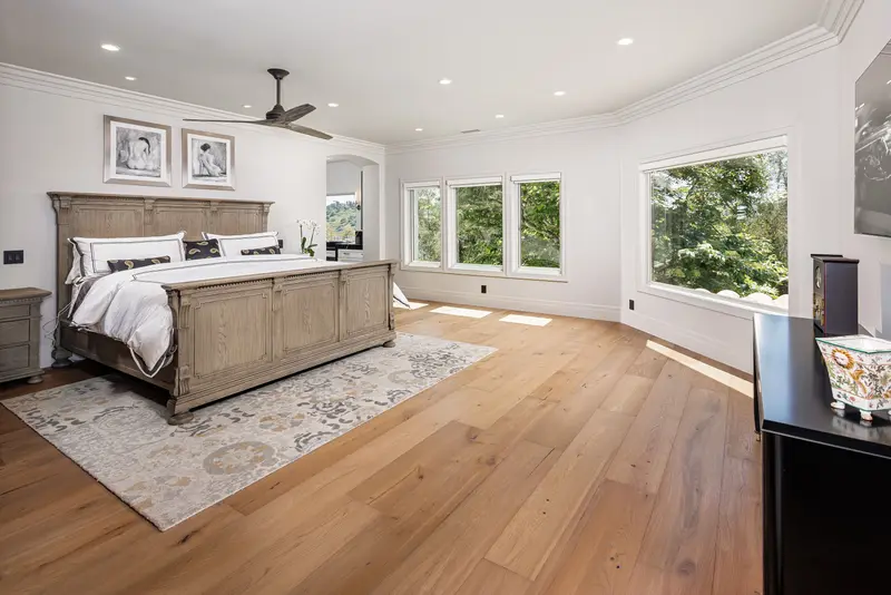 Primary bedroom with carved wood bed — San Juan Capistrano real estate photography