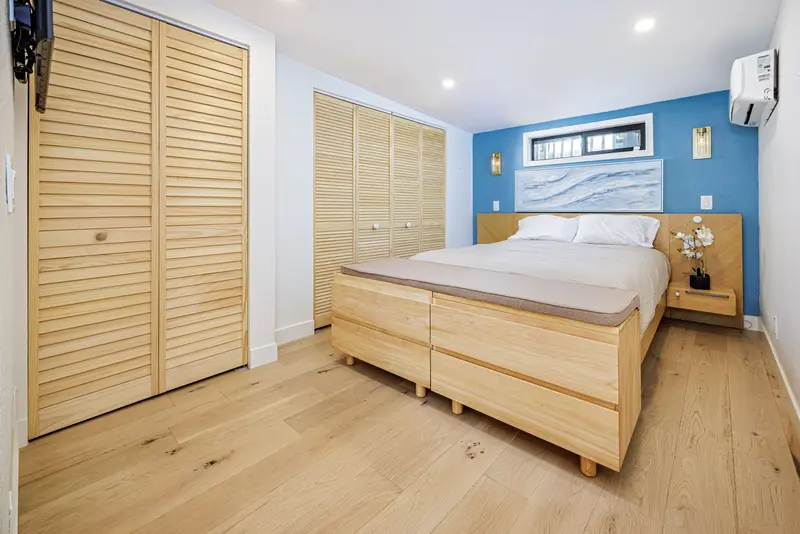Bedroom with blue accent wall — Laguna Beach real estate photography